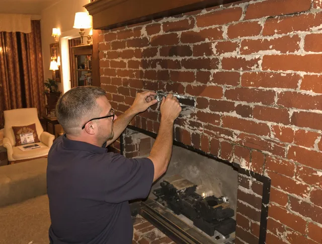 Sanford Chimney Sweep expert fixing a fireplace in Sanford, FL